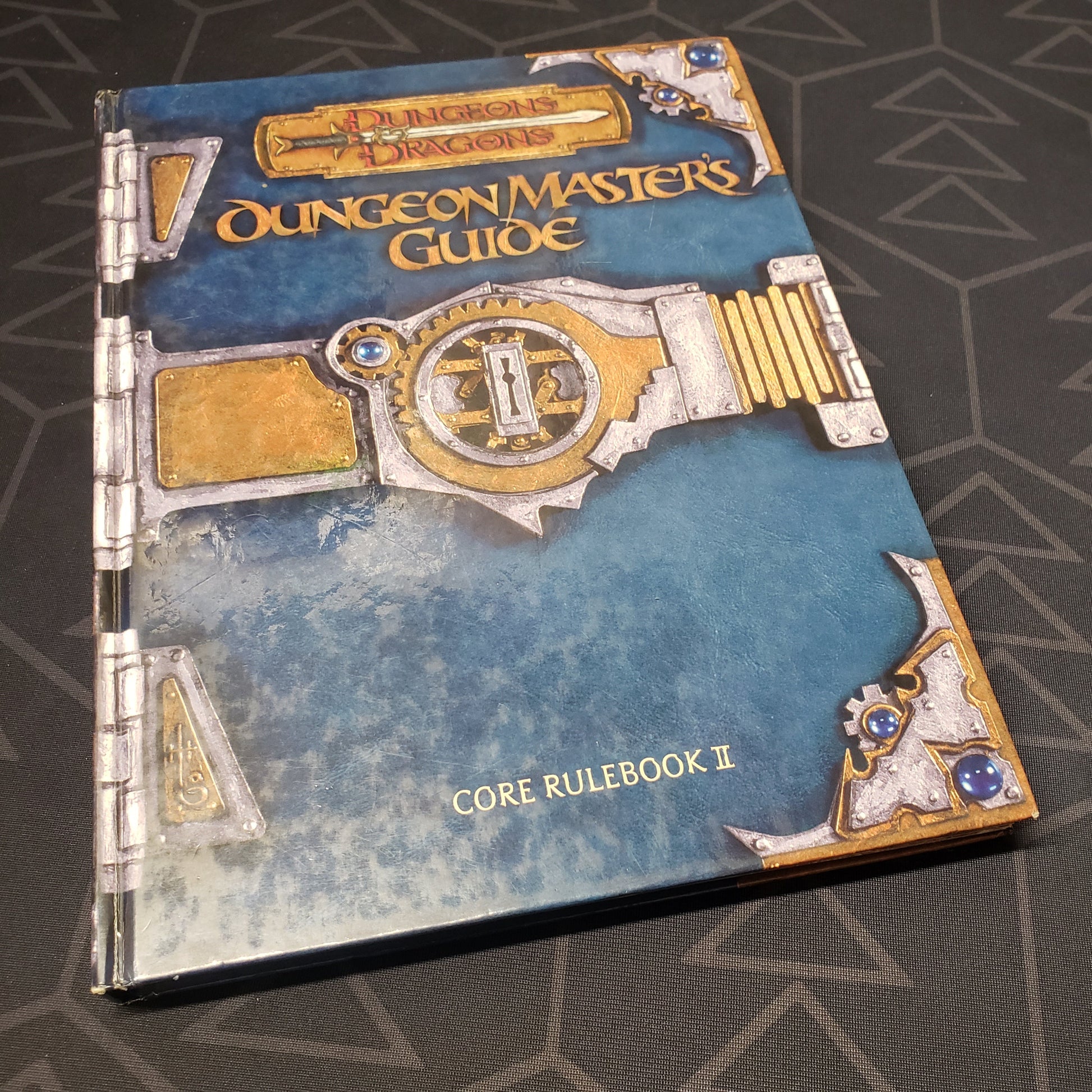Image shows the front cover of the Dungeon Master's Guide book for the roleplaying game Dungeons & Dragons: Third Edition