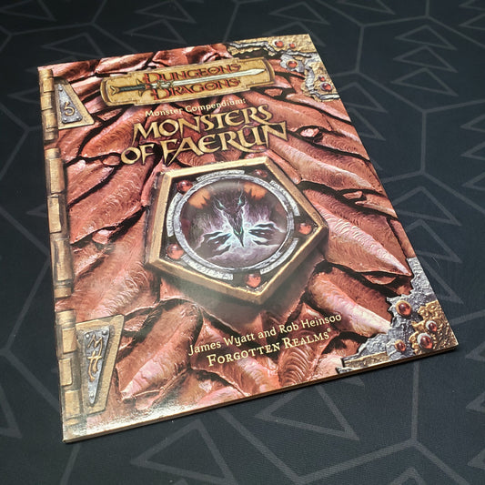 Image shows the front cover of the Monster Compendium: Monsters of Faerun book for the roleplaying game Dungeons & Dragons: Third Edition