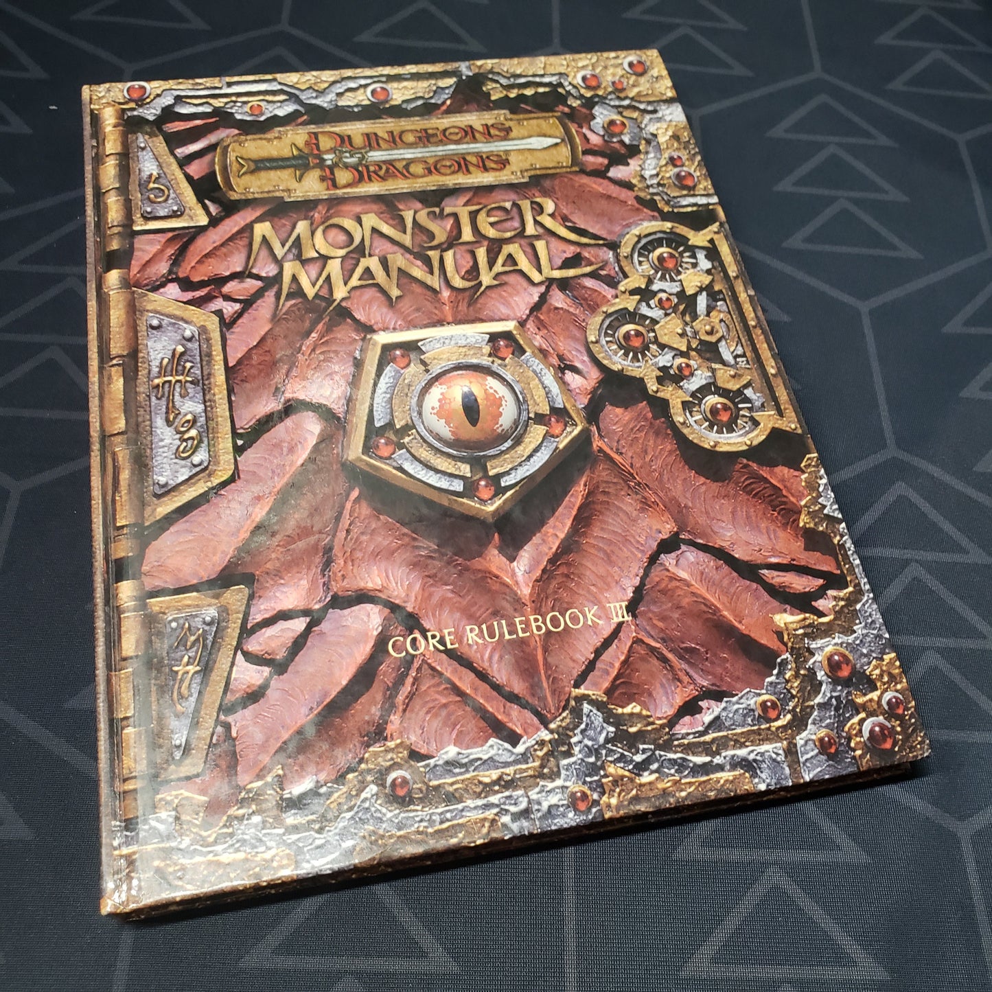 Image shows the front cover of the Monster Manual book for the roleplaying game Dungeons & Dragons: Third Edition