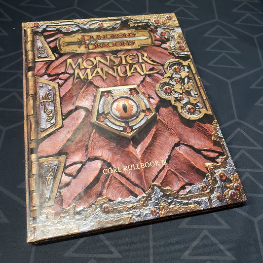 Image shows the front cover of the Monster Manual book for the roleplaying game Dungeons & Dragons: Third Edition