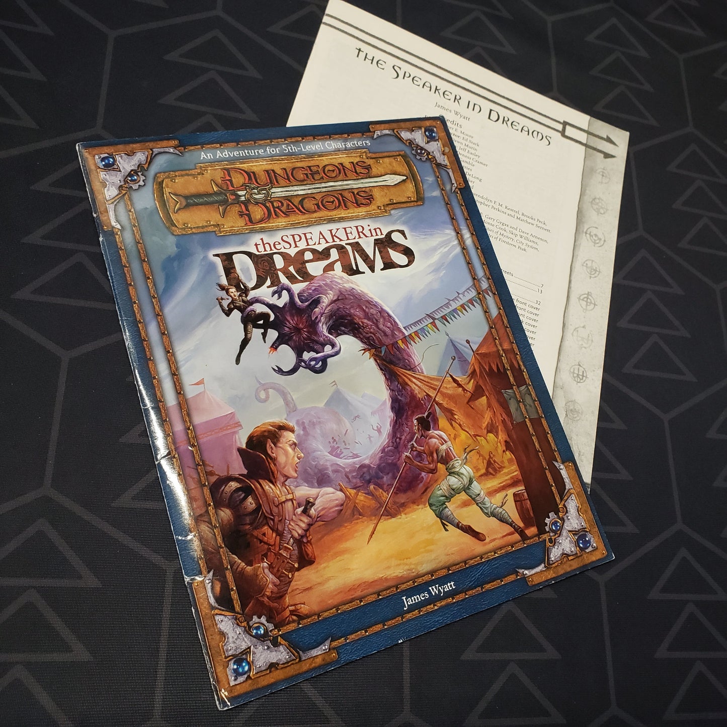 Image shows the front cover of the folio for the Speaker in Dreams adventure module for the roleplaying game Dungeons & Dragons 3E with the booklet fanned out