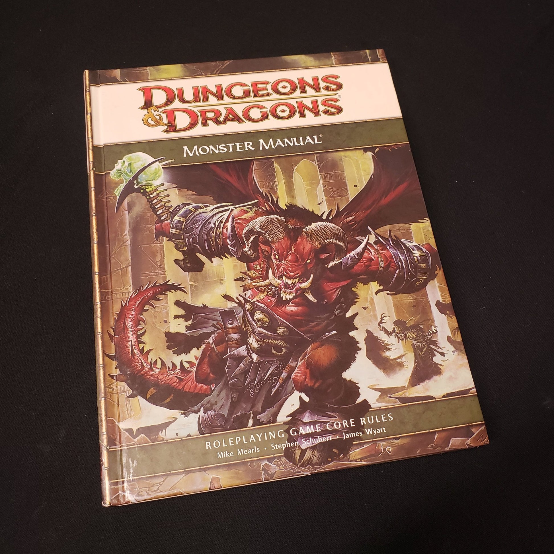 Image shows the front cover of the Monster Manual book for the roleplaying game Dungeons & Dragons: Fourth Edition