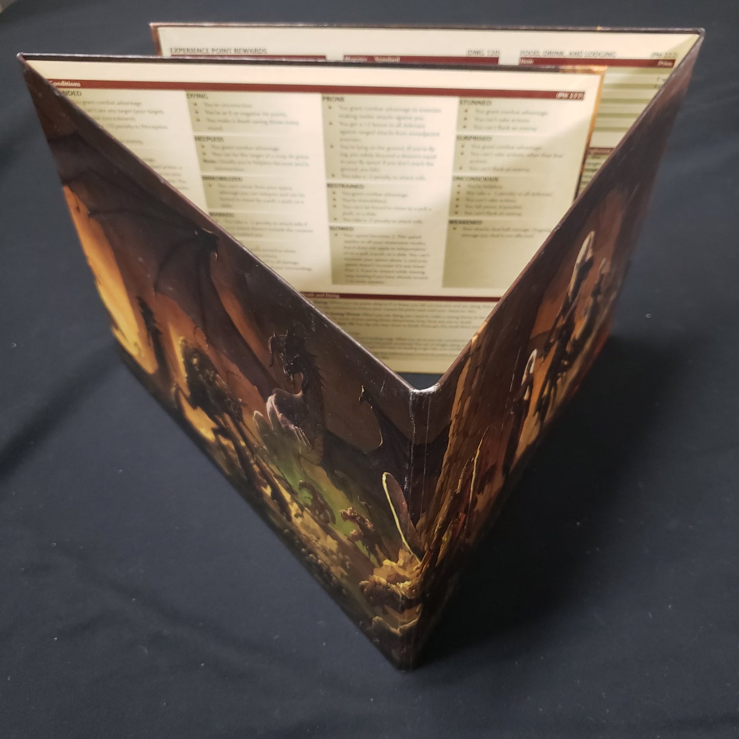 Image shows the Deluxe Dungeon Master's Screen for the roleplaying game Dungeons & Dragons: Fourth Edition arranged in a triangle