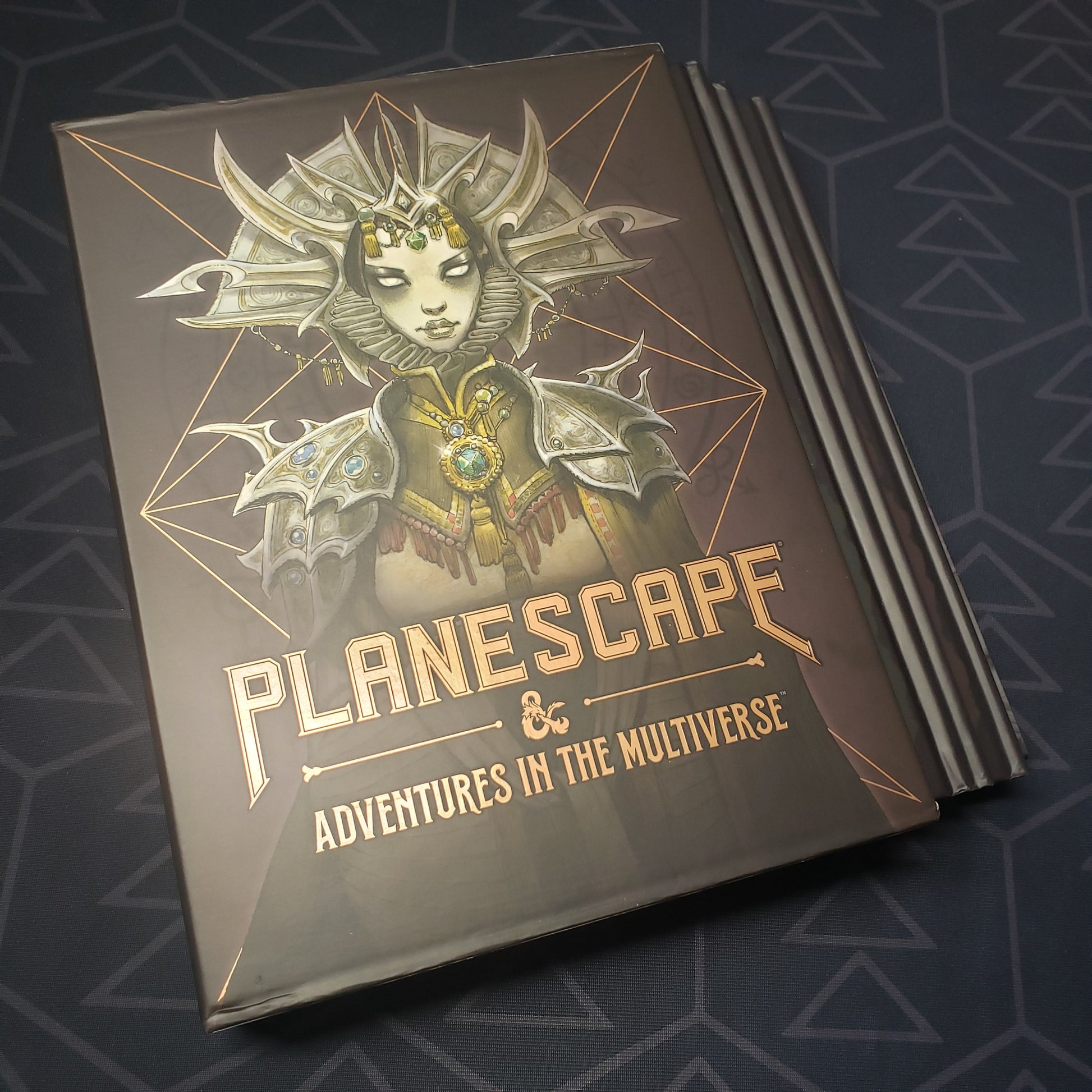 Image shows the front pf the alternate art cover box set of the Planescape: Adventures in the Multiverse books for the roleplaying game Dungeons & Dragons 5E