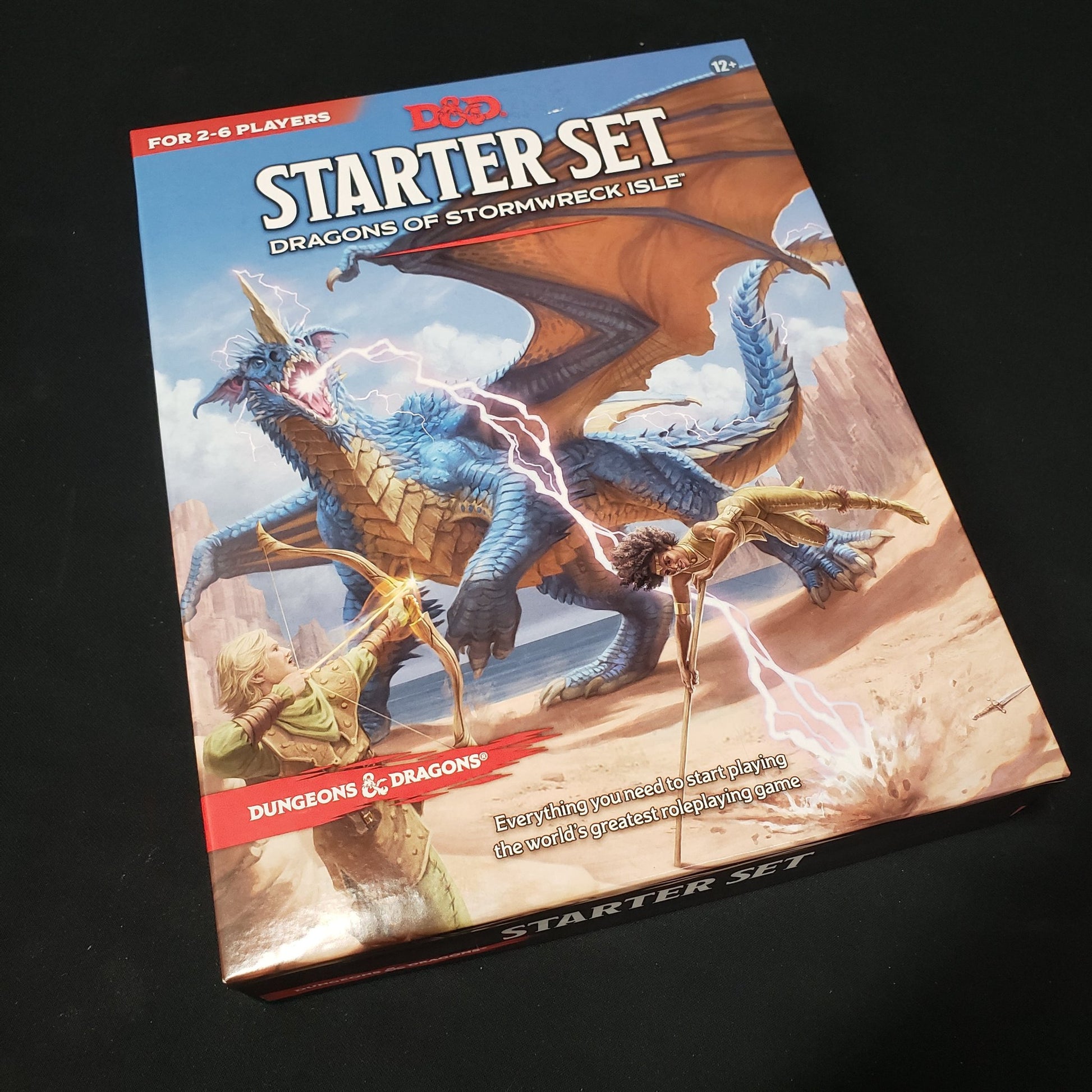 Image shows the front cover of the box of the Dragons of Stormwreck Isle Starter Set for the Dungeons & Dragons roleplaying game