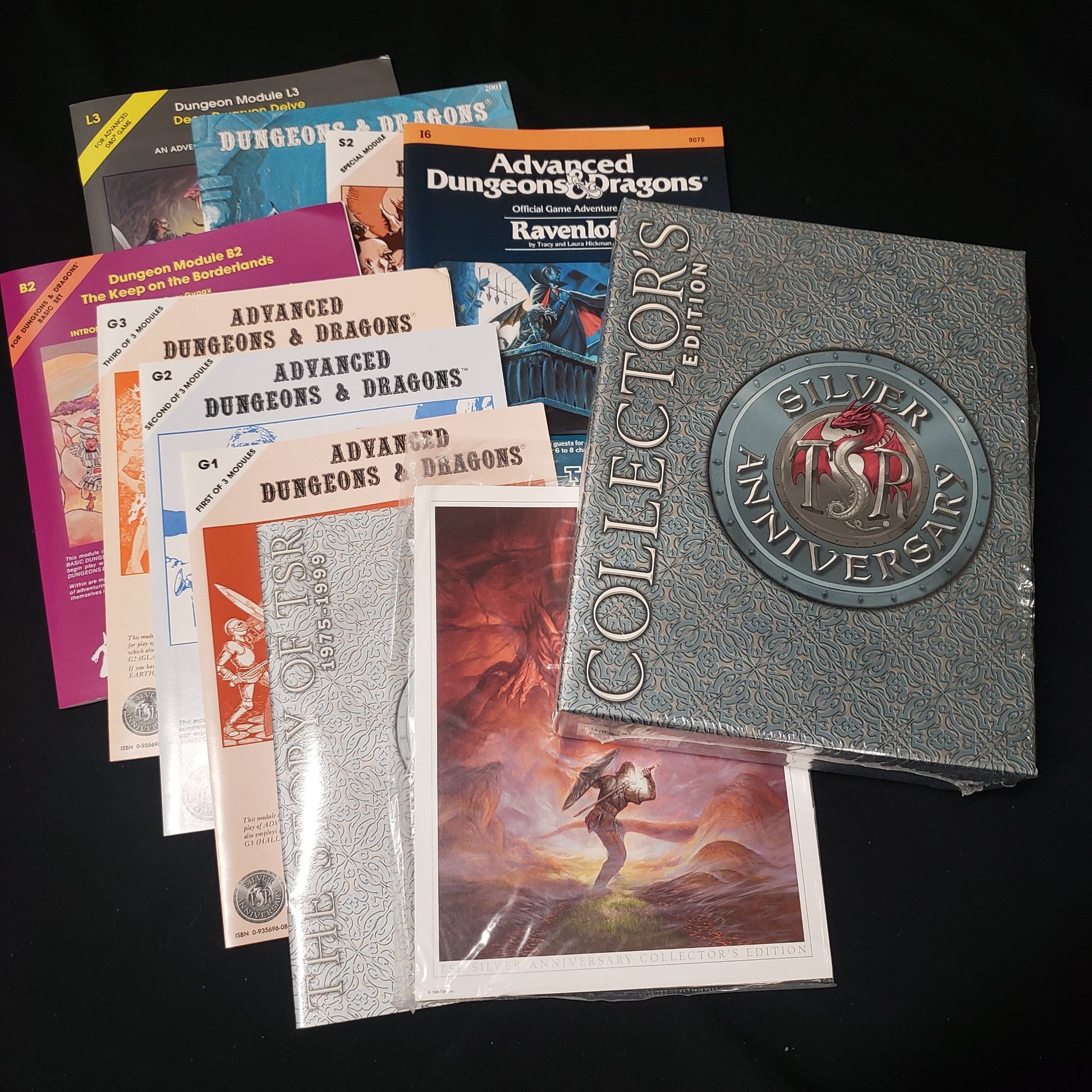 Image shows the box with the booklets spread out around it for the TSR Silver Anniversary Collector's Ediion box set for the roleplaying game Dungeons & Dragons