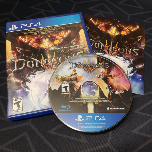 Image shows the case, manual & disc for the video game Dungeons III for Playstation 4