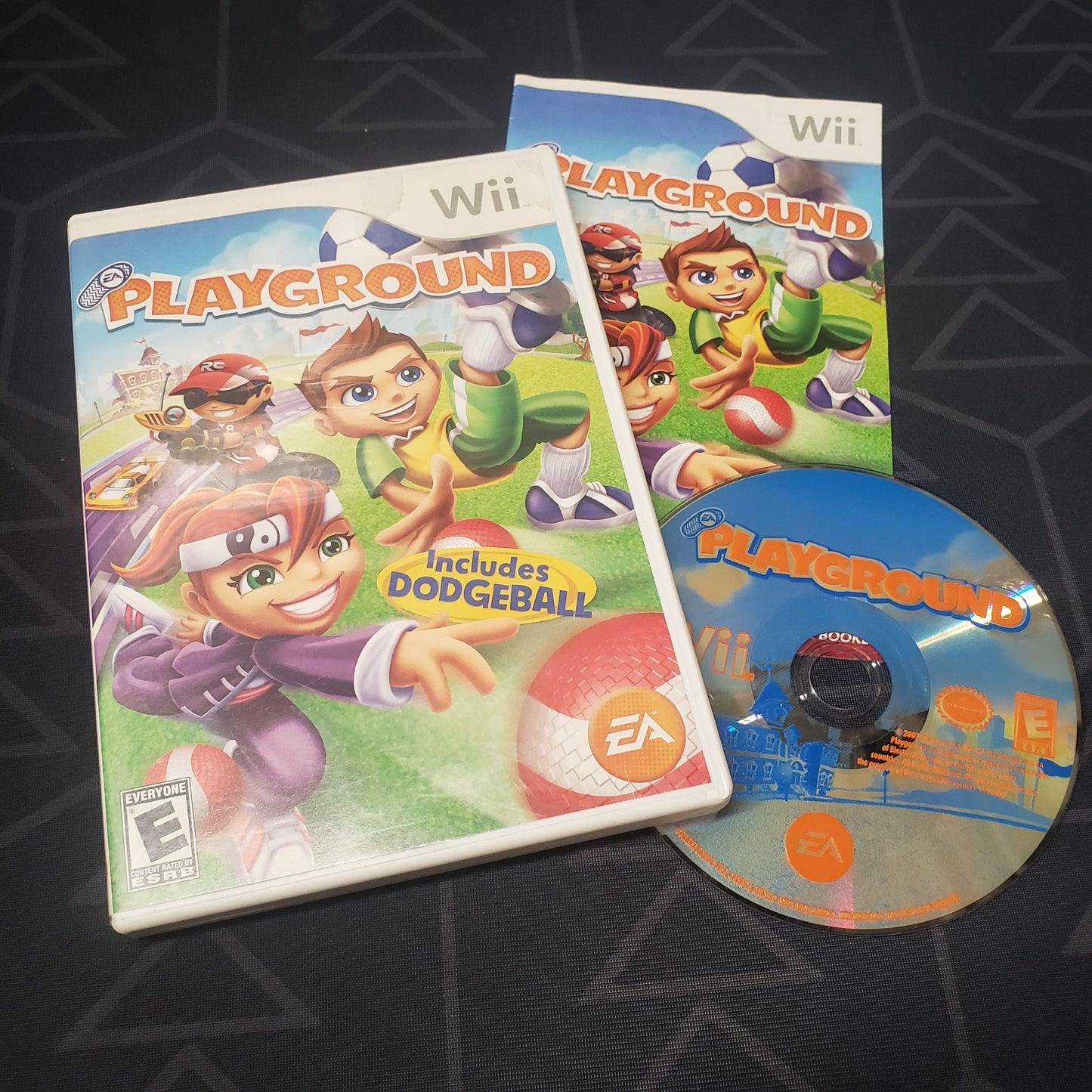 Image shows the case, manual and disc for the video game EA Playground for Nintendo Wii