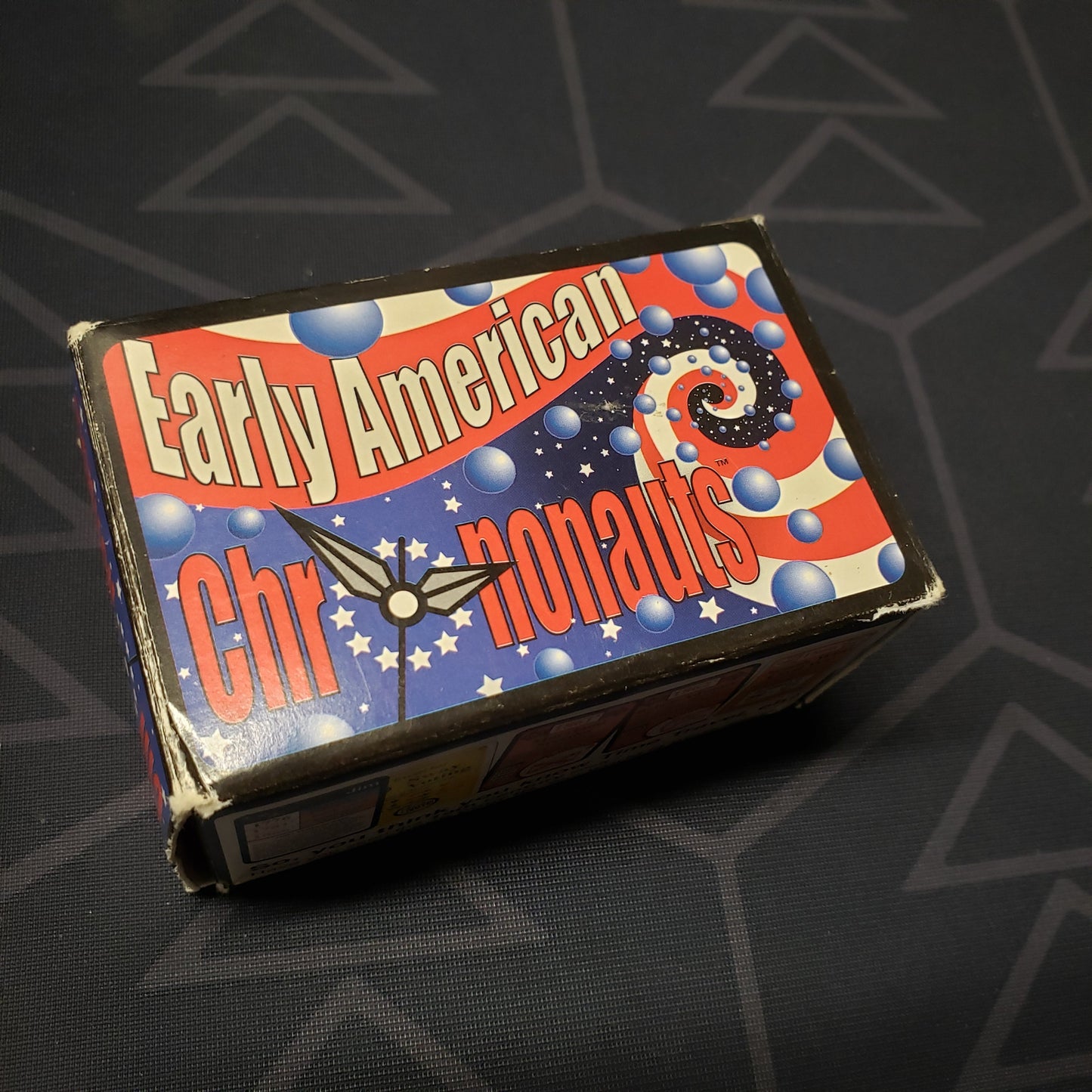 Image shows the front cover of the box for the Early American Chrononauts card game