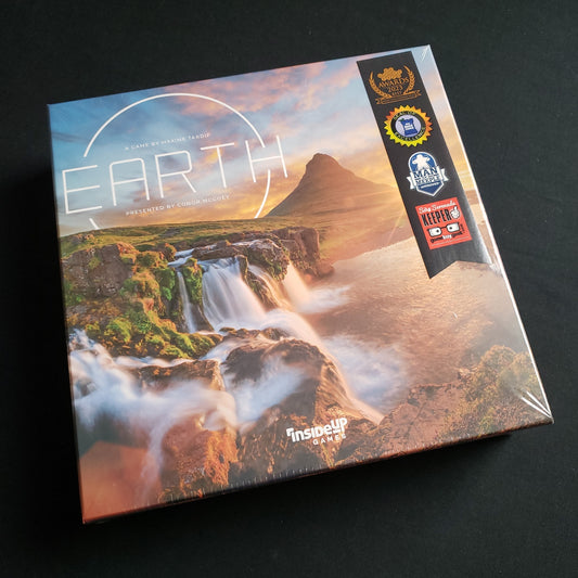 Image shows the front cover of the box of the board game Earth