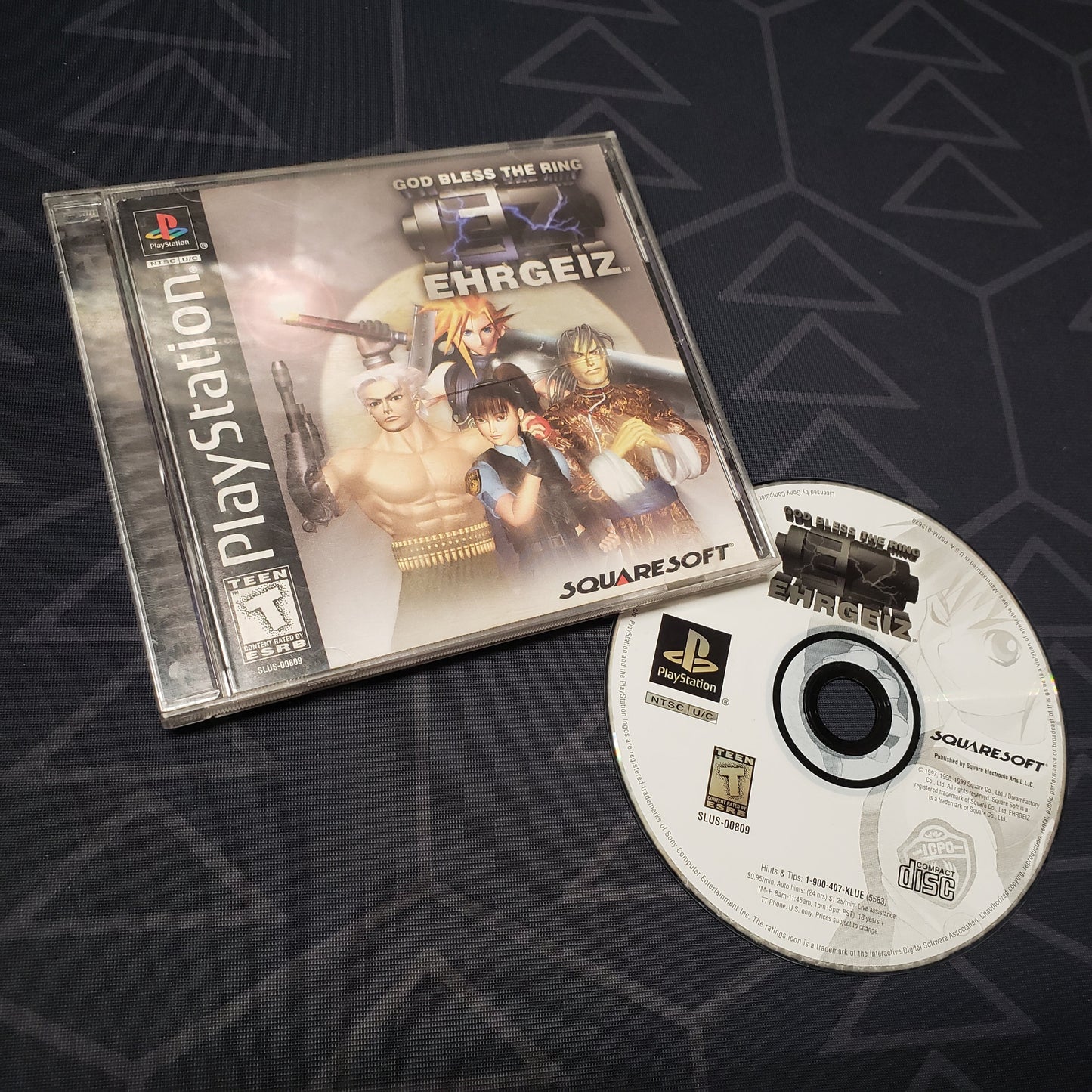Image shows the jewel case with manual and disc for the video game Ehrgeiz: God Bless the Ring for Playstation 1