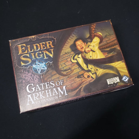 Image shows the front cover of the box for the Gates of Arkham expansion from the board game Elder Sign