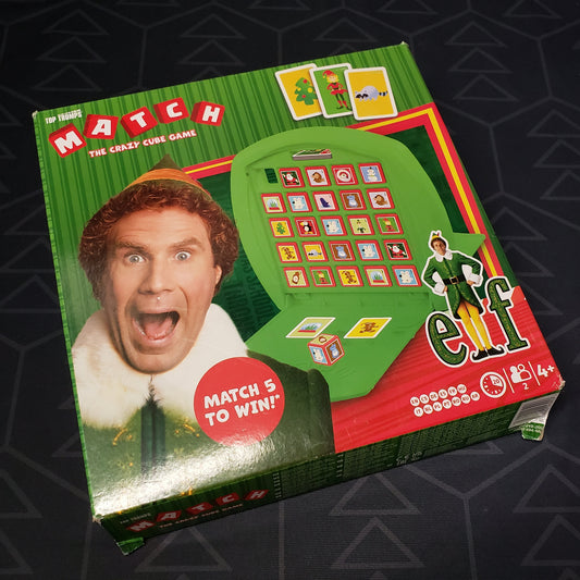 Image shows the front cover of the box for the Elf Match board game