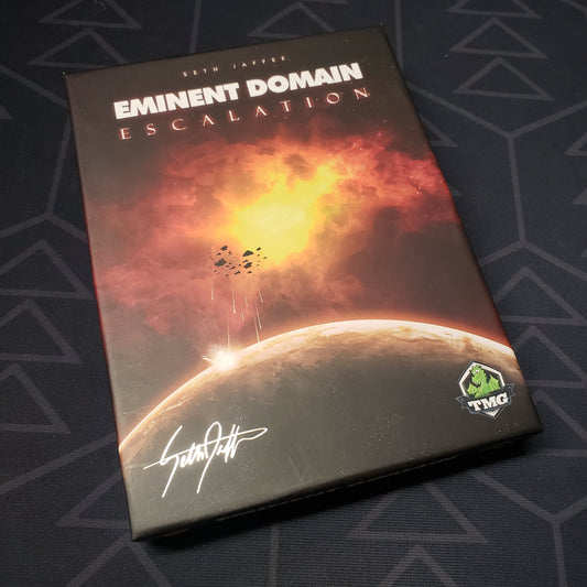 Image shows the front cover of the box of the Escalation expansion for the card game Eminent Domain