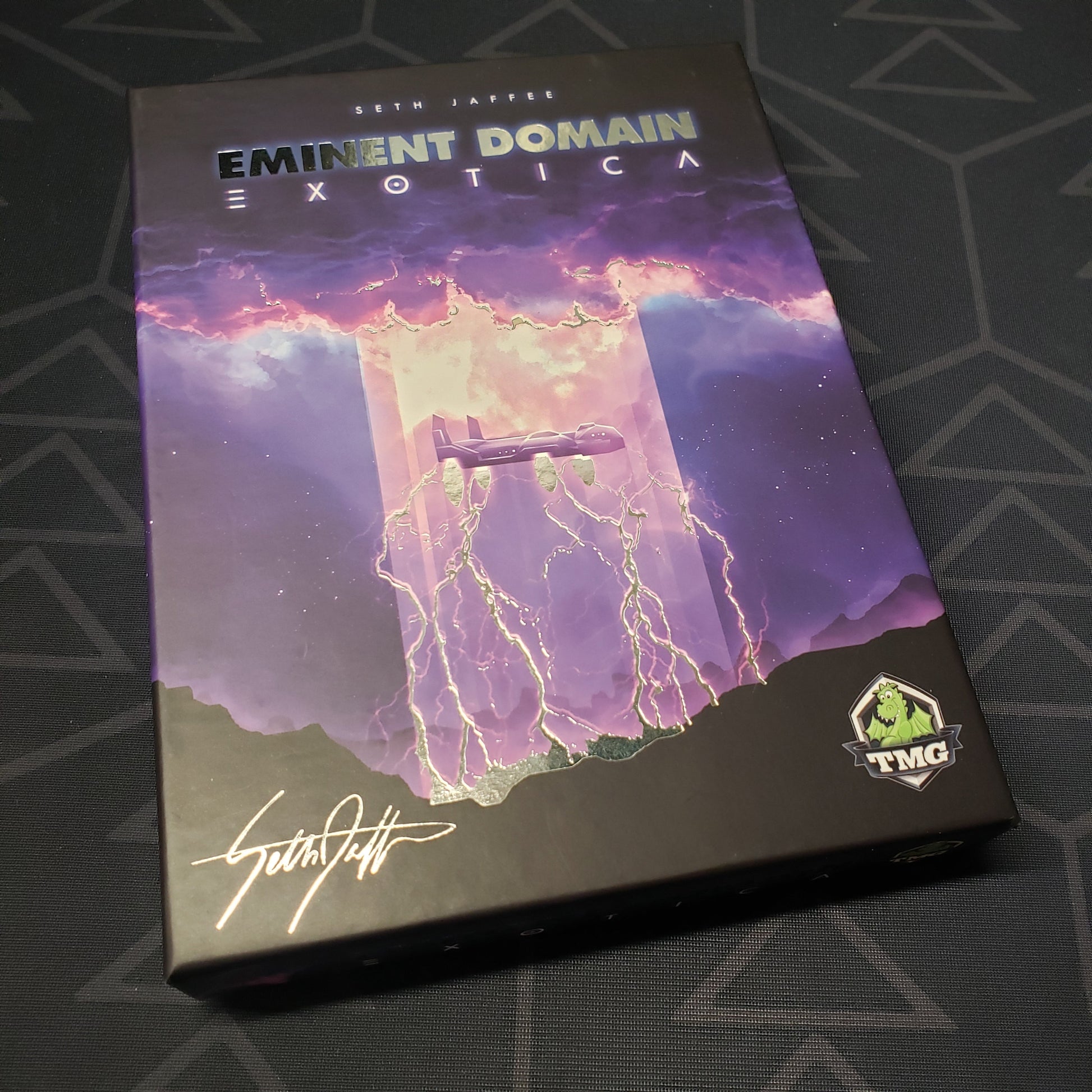 Image shows the front cover of the box of the Exotica expansion for the card game Eminent Domain