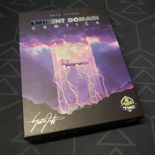 Image shows the front cover of the box of the Exotica expansion for the card game Eminent Domain