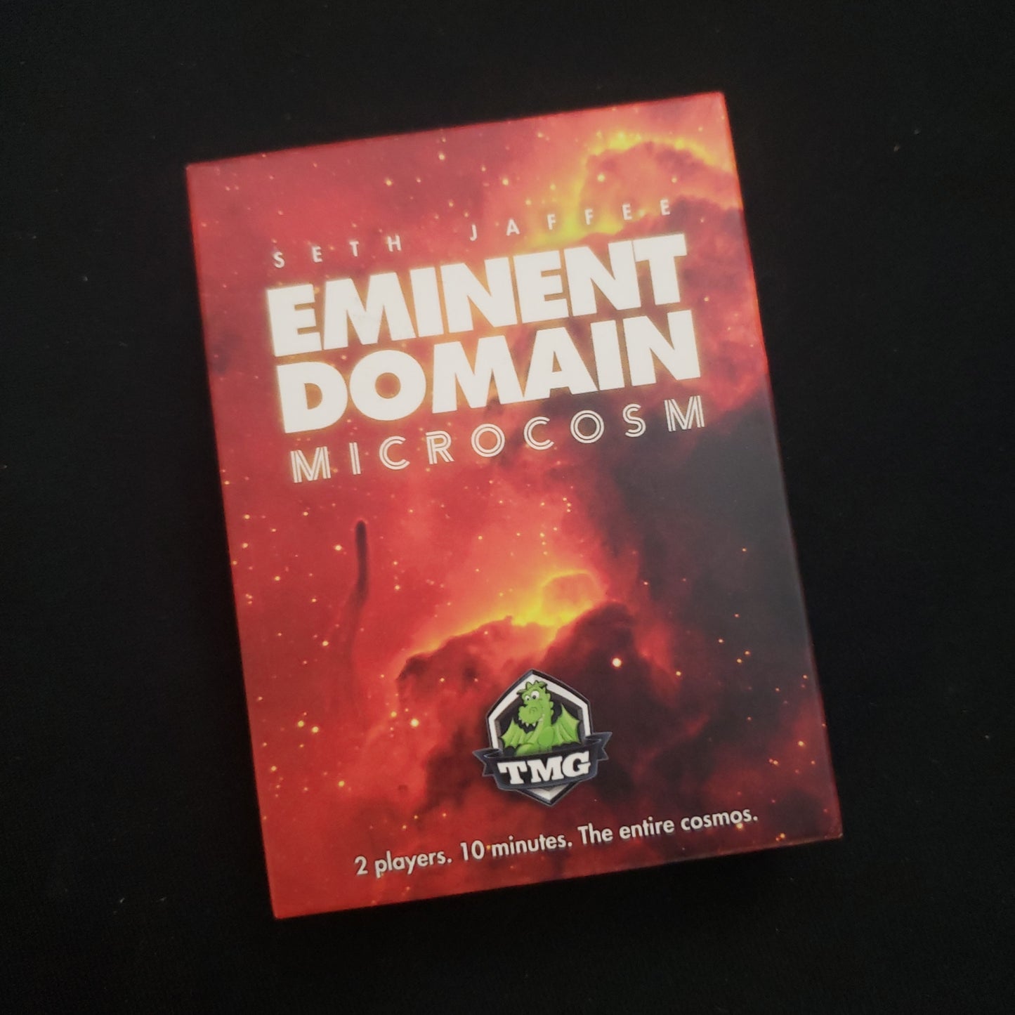 Image shows the front cover of the box of the card game Eminent Domain: Microcosm