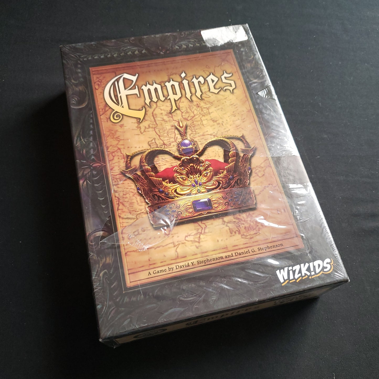 Image shows the front cover of the box of the Empires board game
