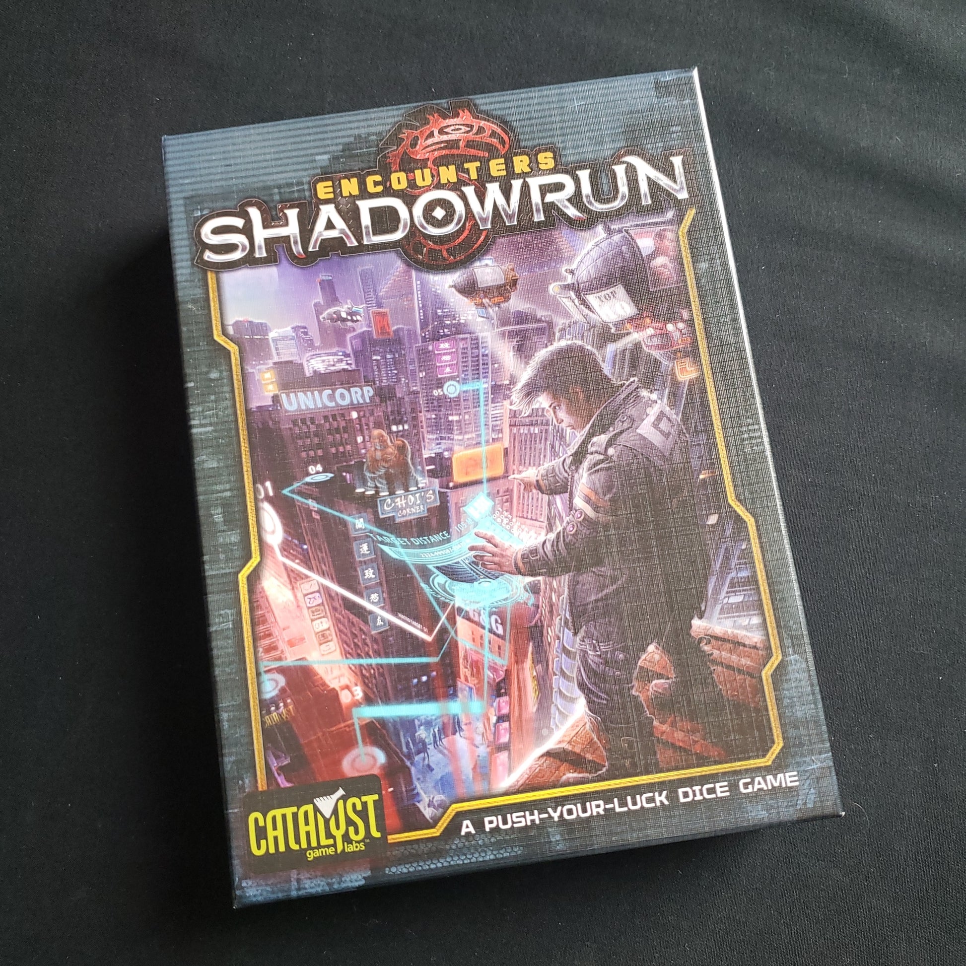 Image shows the front cover of the box of the Encounters: Shadowrun board game