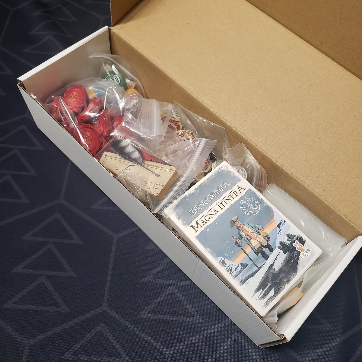 Image shows the inside of the box of the Deluxe Components pack for the board game Encyclopedia