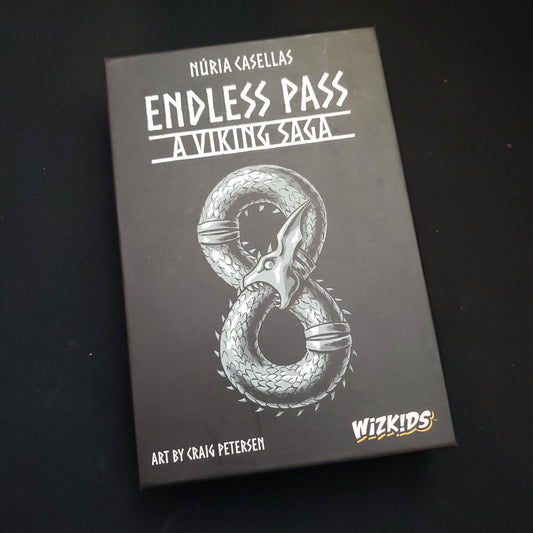 Image shows the front cover of the box of the Endless Pass board game