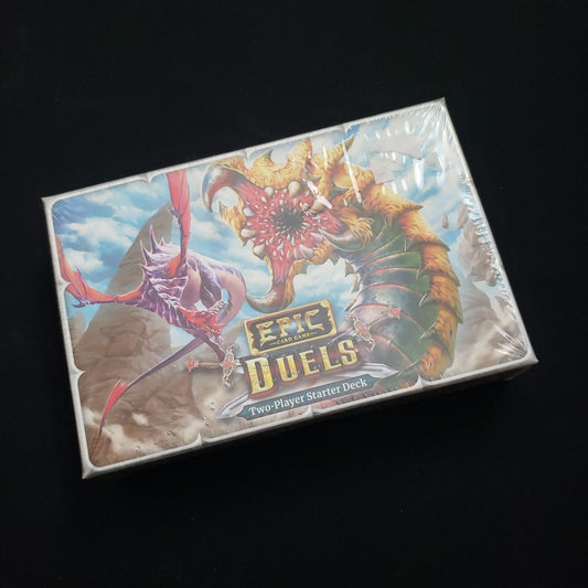 Image shows the front cover of the box of the Duels version of the Epic card game