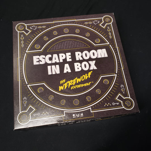 Image shows the front cover of the box of the Escape Room in a Box: The Werewolf Experiment board game