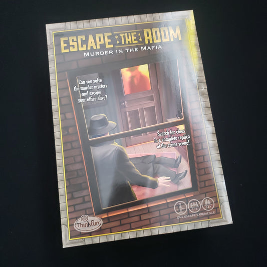 Image shows the front cover of the box of the Escape the Room: Murder in the Mafia puzzle game
