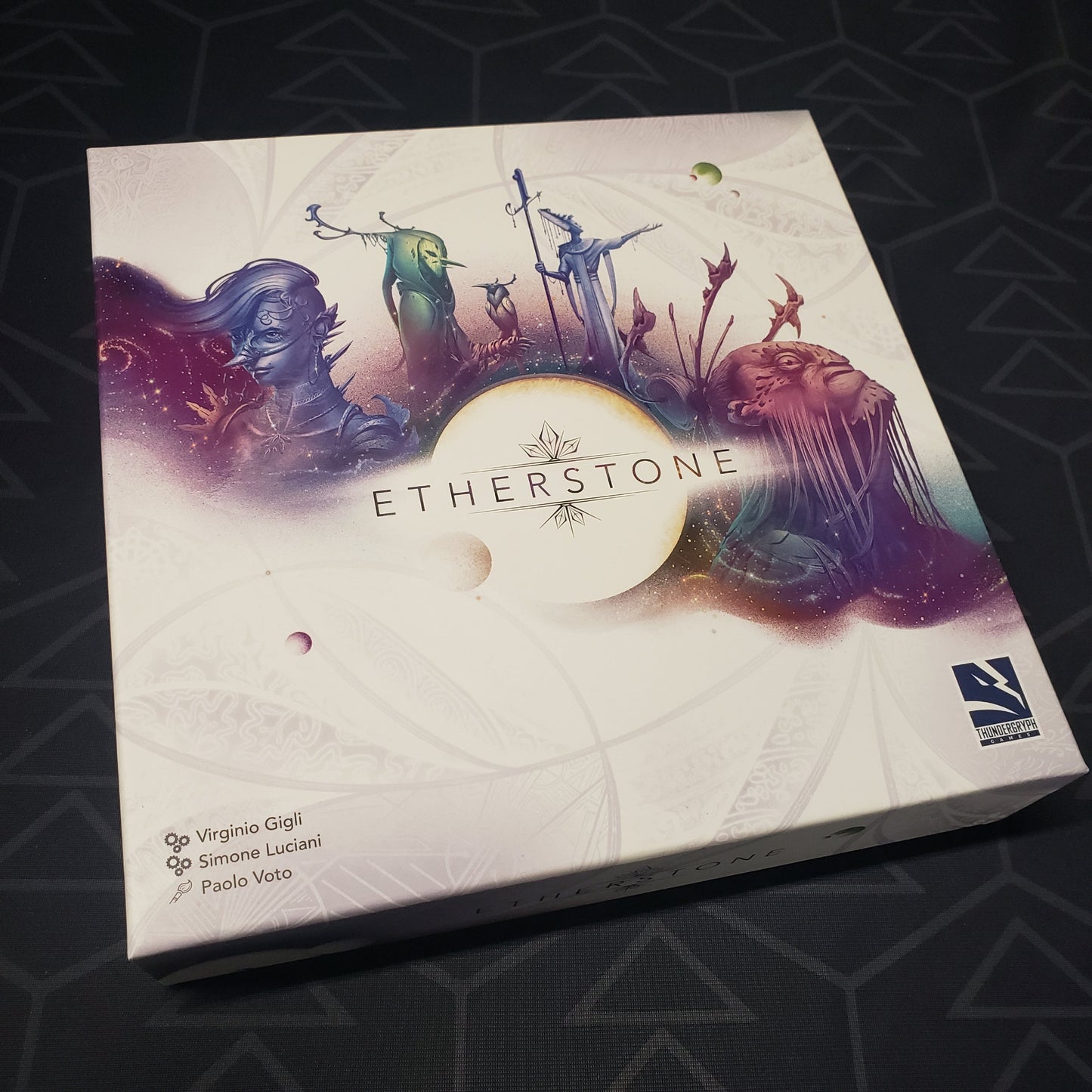 Image shows the front cover of the box for the Etherstone card game