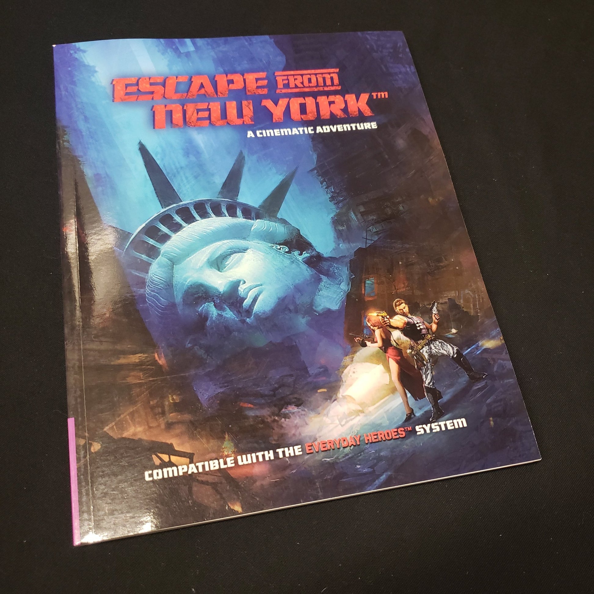 Image shows the front cover of the Escape From New York Cinematic Adventure book for the roleplaying game Everyday Heroes