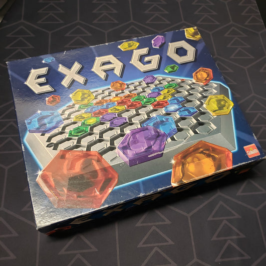 Image shows the front cover of the box for the Exago board game
