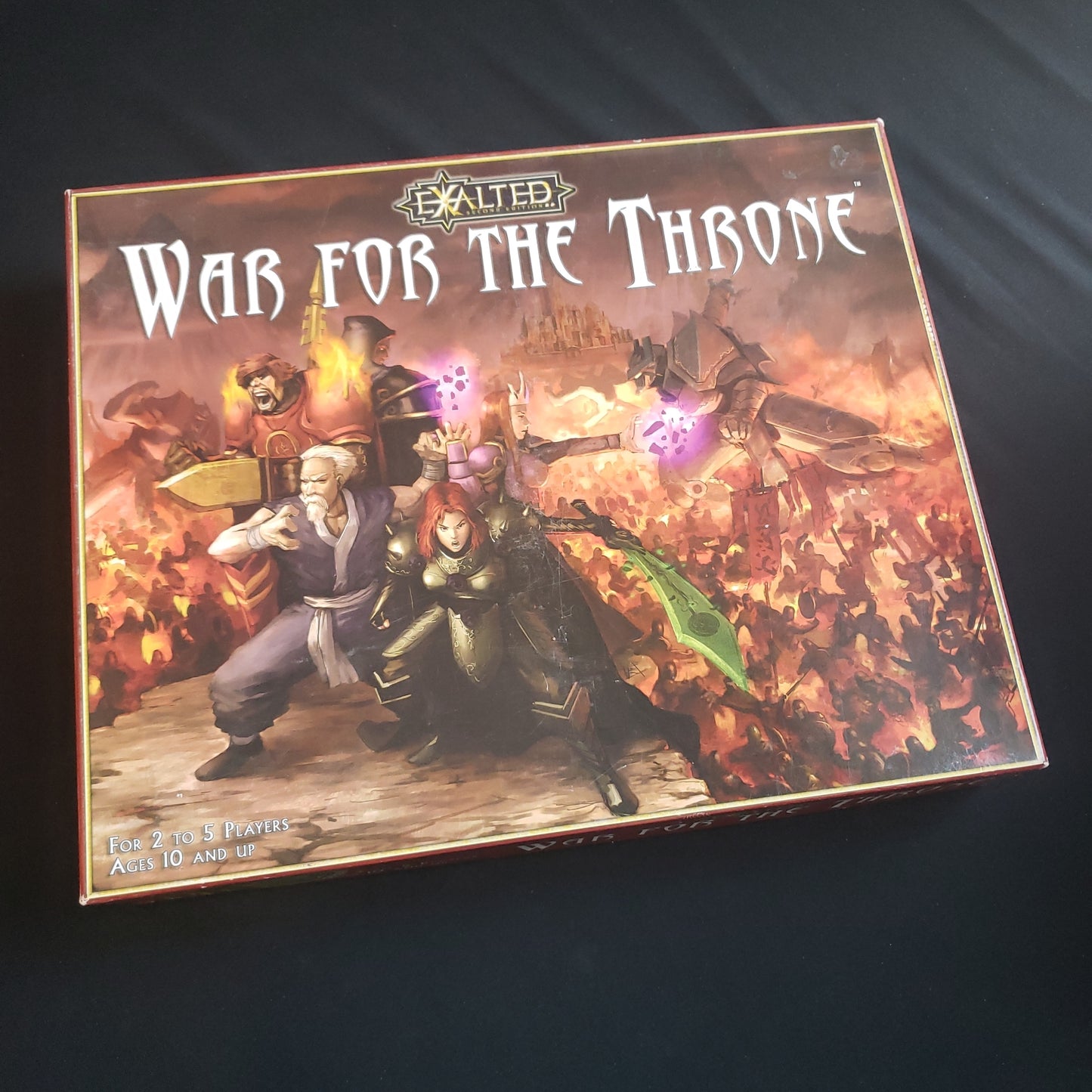 Image shows the front cover of the box of the Exalted: War for the Throne board game