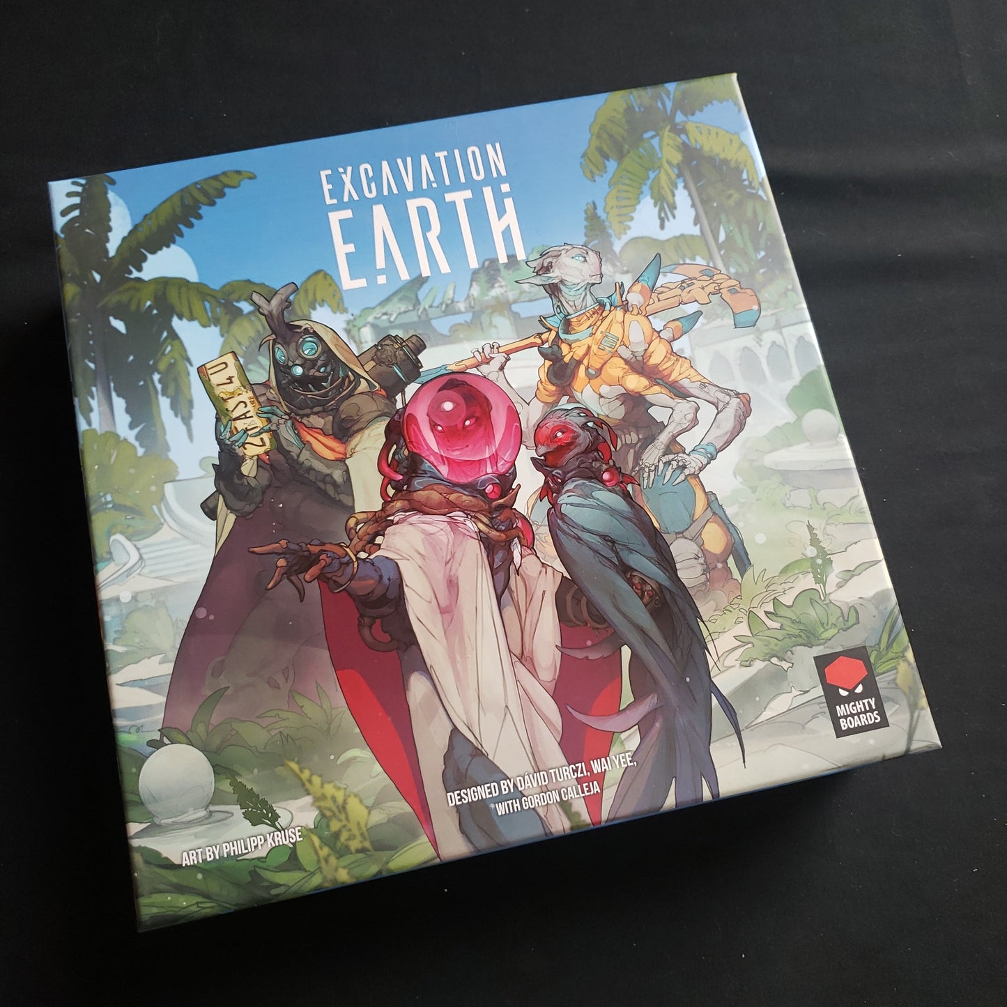 Image shows the front cover of the box of the Excavation Earth board game