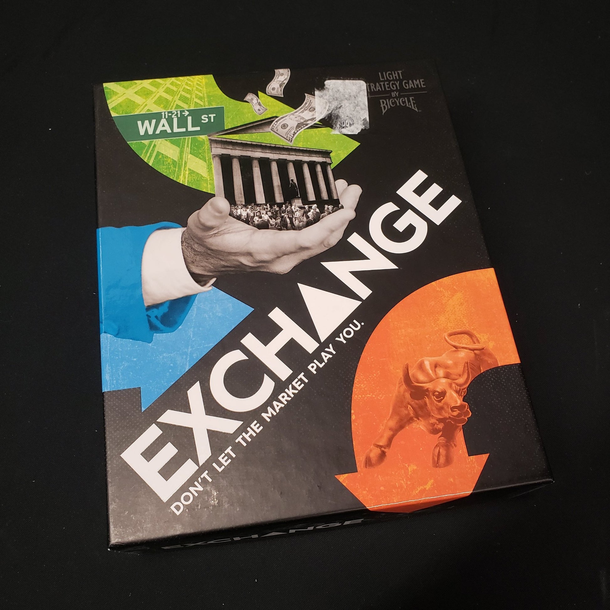 Image shows the front cover of the box of the Exchange board game