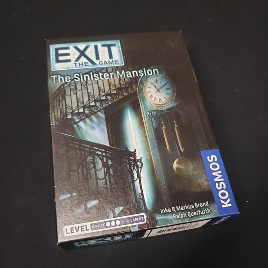 Image shows the front cover of the box of the Exit: The Sinister Mansion  escape room game