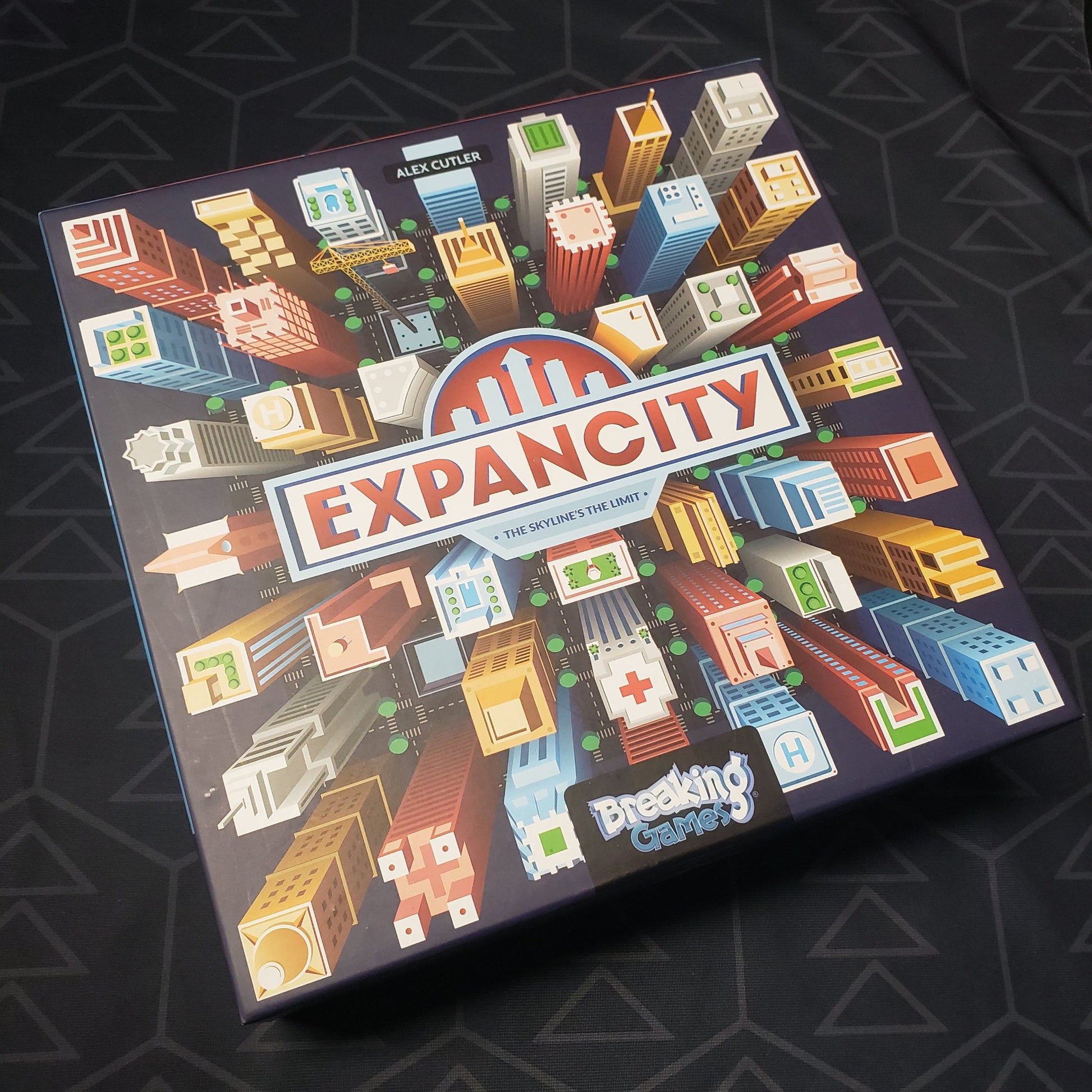 Image shows the front cover of the box for the Expancity board game
