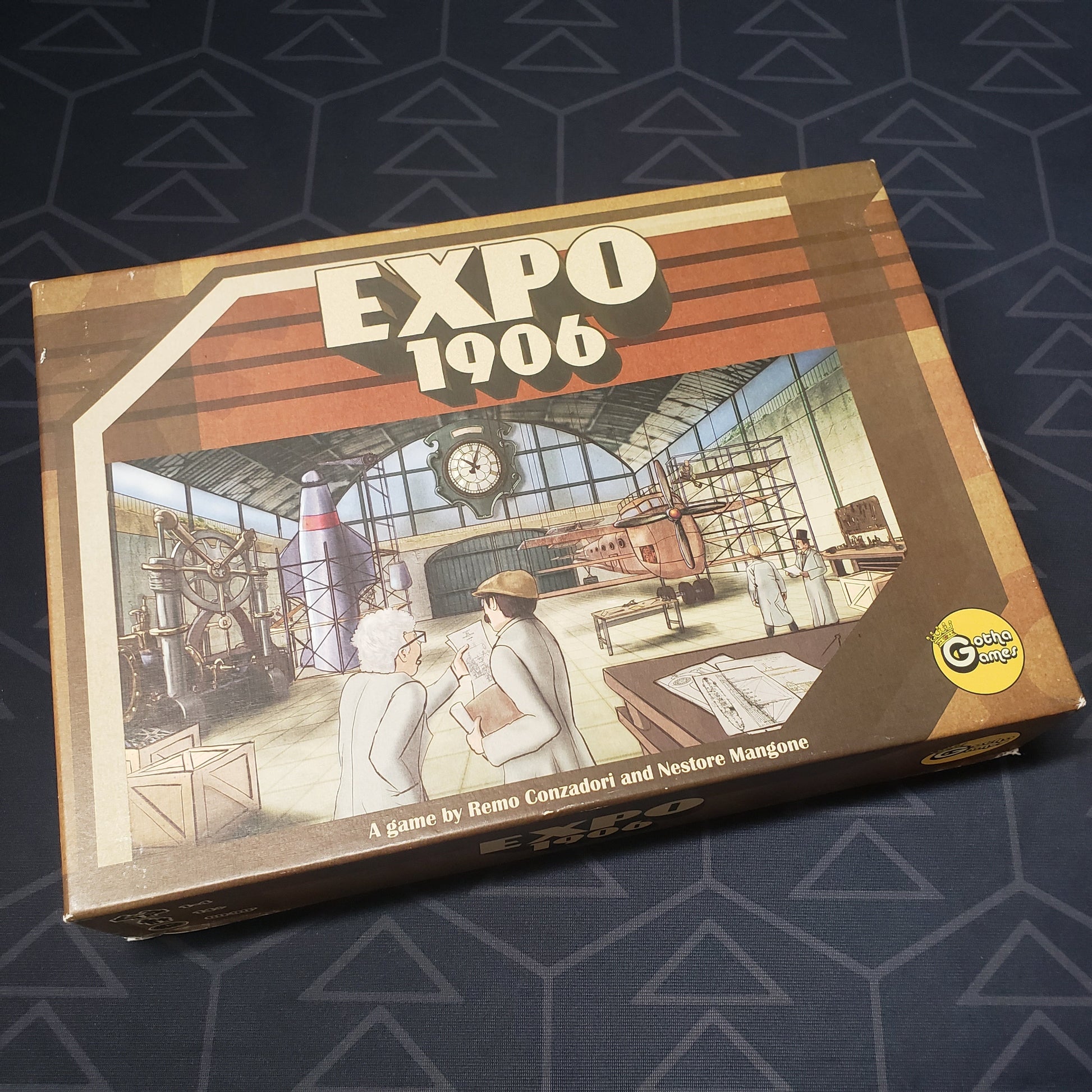 Image shows the front cover of the box for the Expo 1906 board game