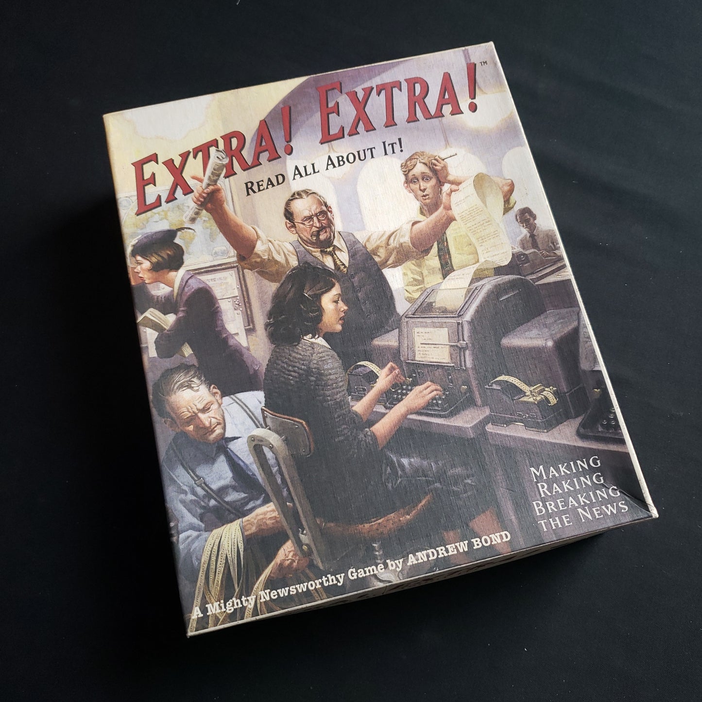 Image shows the front cover of the box of the Extra! Extra! board game