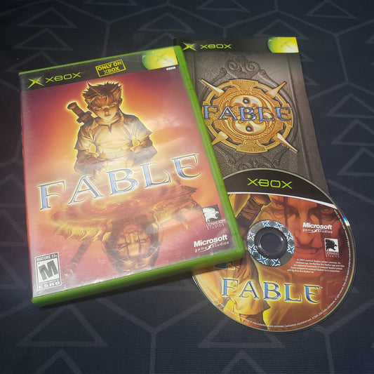 Image shows the case, manual and disc for the video game Fable for the original Xbox