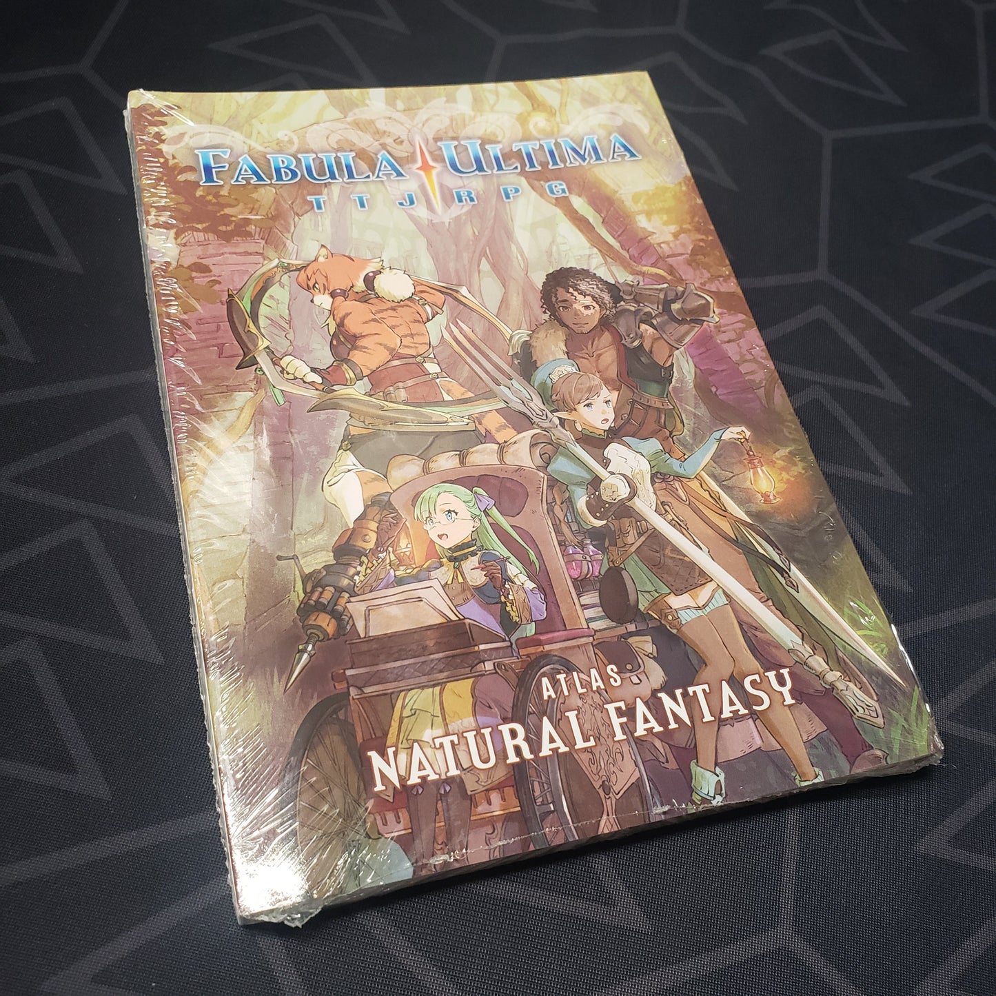 Image shows the front cover of the Natural Fantasy Atlas book for the roleplaying game Fabula Ultima