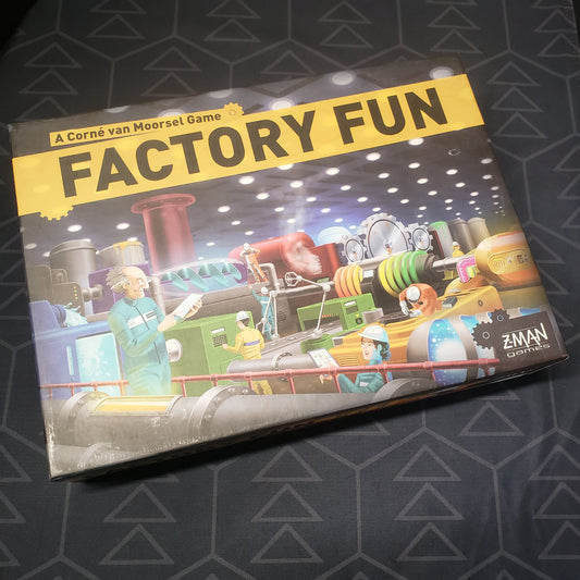 Image shows the front cover of the box for the Factory Fun board game