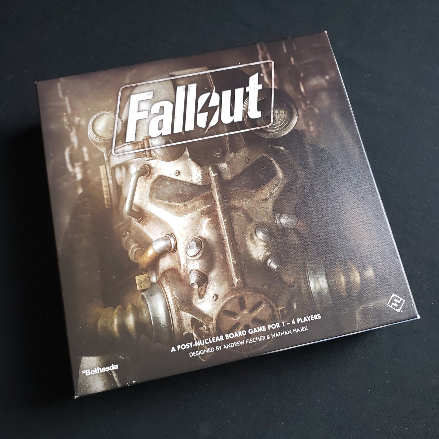 Image shows the front cover of the box of the Fallout board game
