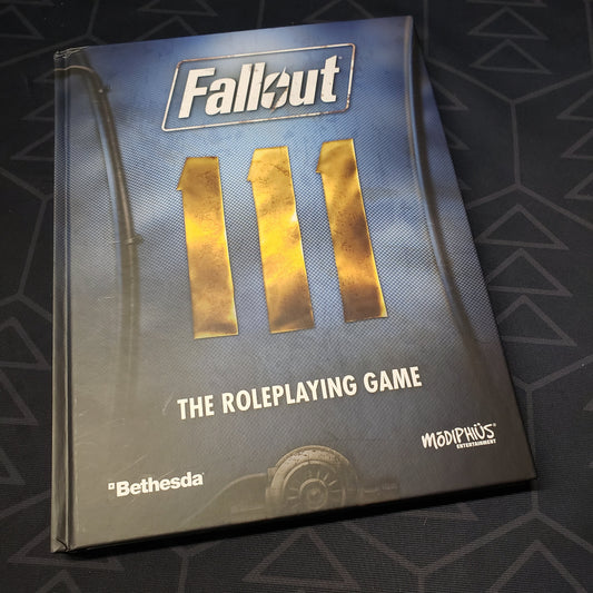 Image shows the front cover of the core rulebook for the Fallout roleplaying game