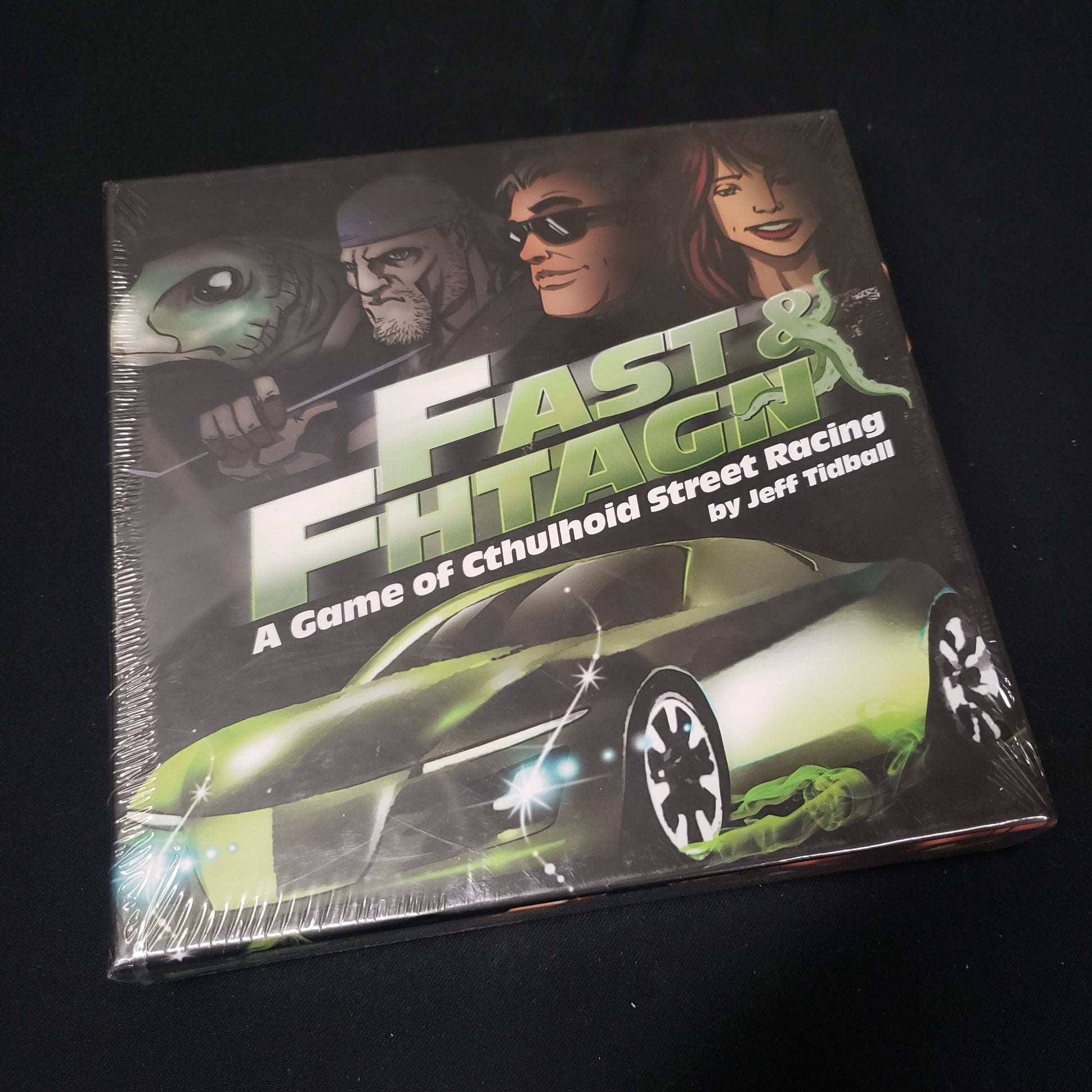 Image shows the front cover of the box of the Fast & Fhtagn card game