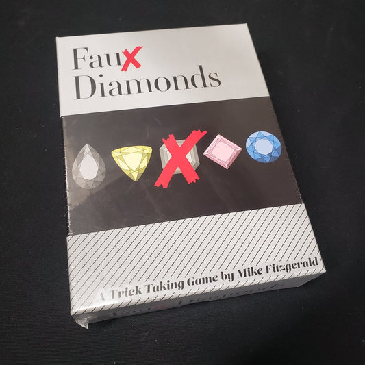 Image shows the front cover of the box of the Faux Diamonds card game
