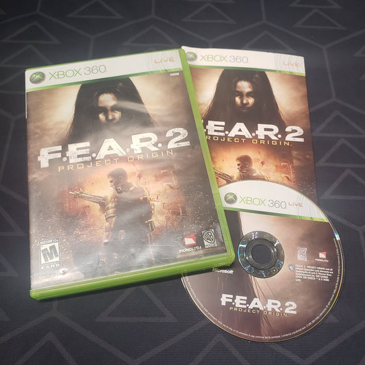 Image shows the case, manual and disc for the video game F.E.A.R. 2: Project Origin for Xbox 360