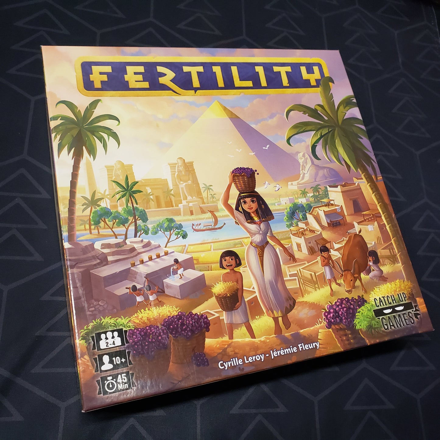 Image shows the front cover of the box for the Fertility board game