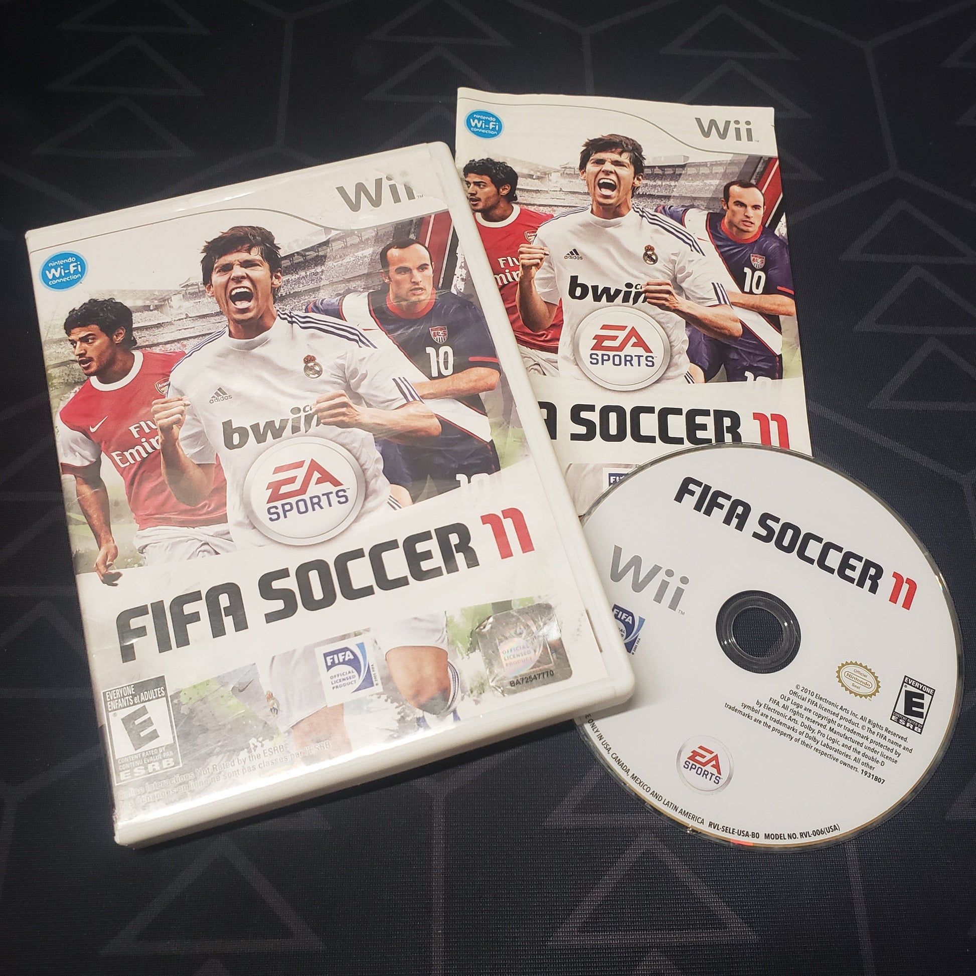 Image shows the case, manual and disc for the video game FIFA Soccer 11 for Nintendo Wii