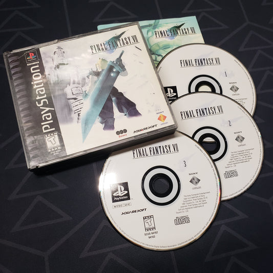 Image shows the jewel case, manual and three discs for the video game Final Fantasy VII for Playstation 1
