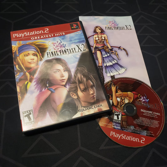Image shows the case, manual and disc for the video game Final Fantasy X-2 for Playstation 2